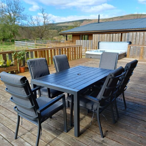 Mid Wales Lodges_outside seating on decking with view of the mountains