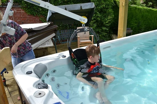Wall lift swim spa